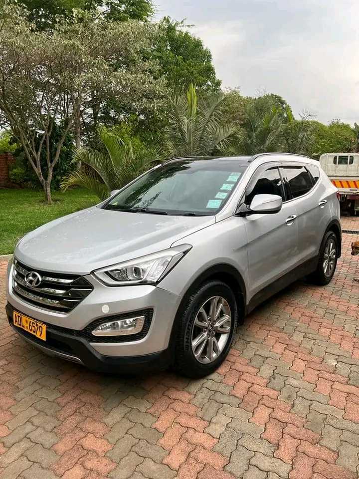 2014 Hyundai SantaFe

$32000 negotiable 

Make: Hyundai
Model: SantaFe 
Body Type: SUV
Year: 2014
Mileage: 93700km
Colour: Silver
Fuel: Petrol with fuel estimate mileage calculator 
Engine Capacity: 2400cc
Doors: 5
Sitting capacity: 7 seater
Power windows
Power mirrors 
Cruise control 
Blue tooth
Hard drive storage for music
Sunroof
Heated seats
Dual heating system 
USB Ports
One owner since new 

Call or whatsapp me on 0783666294